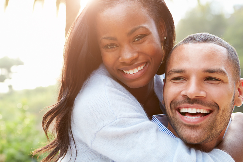 African American young woman hugging man, happy, love
